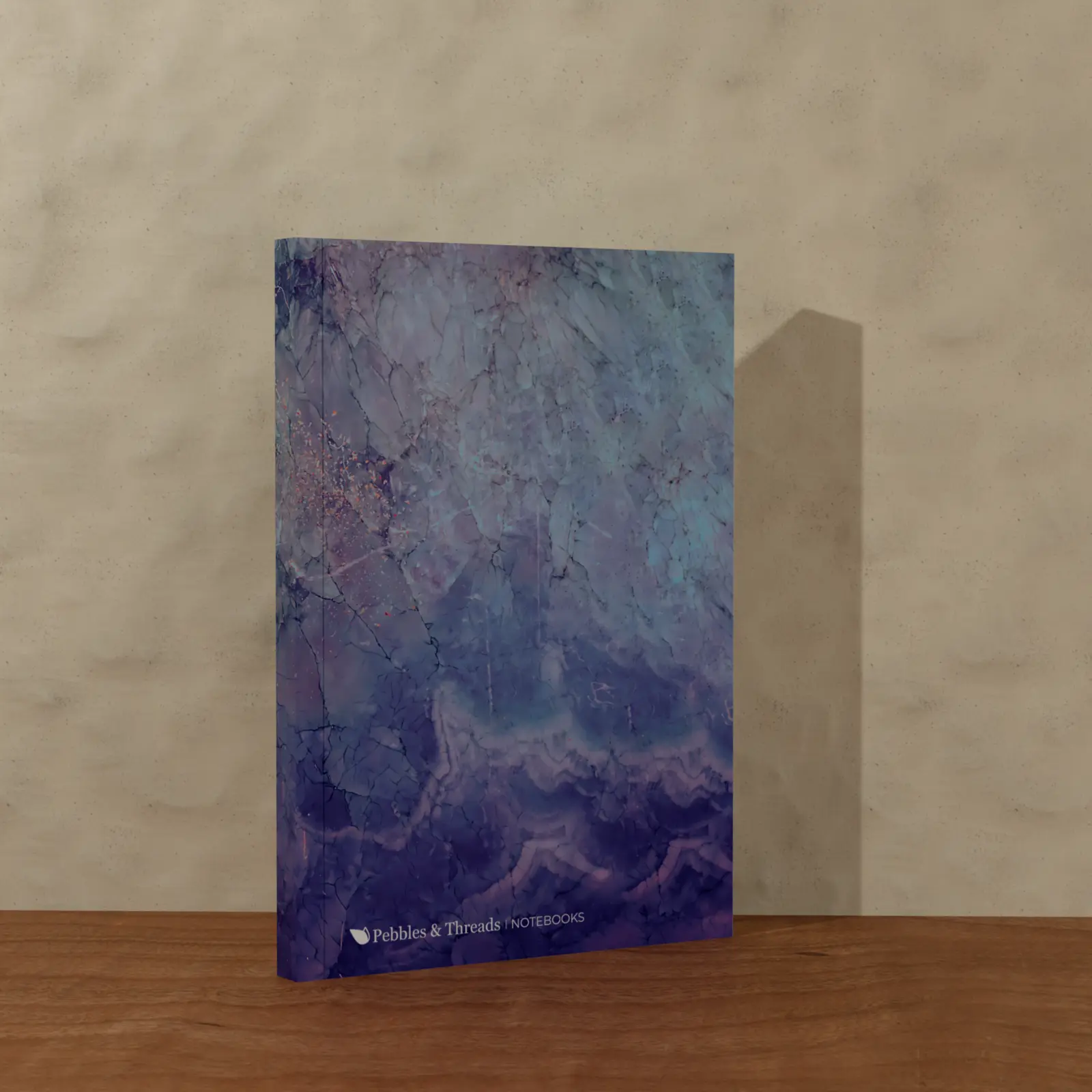 Blue Waves notebook standing in warm directional light