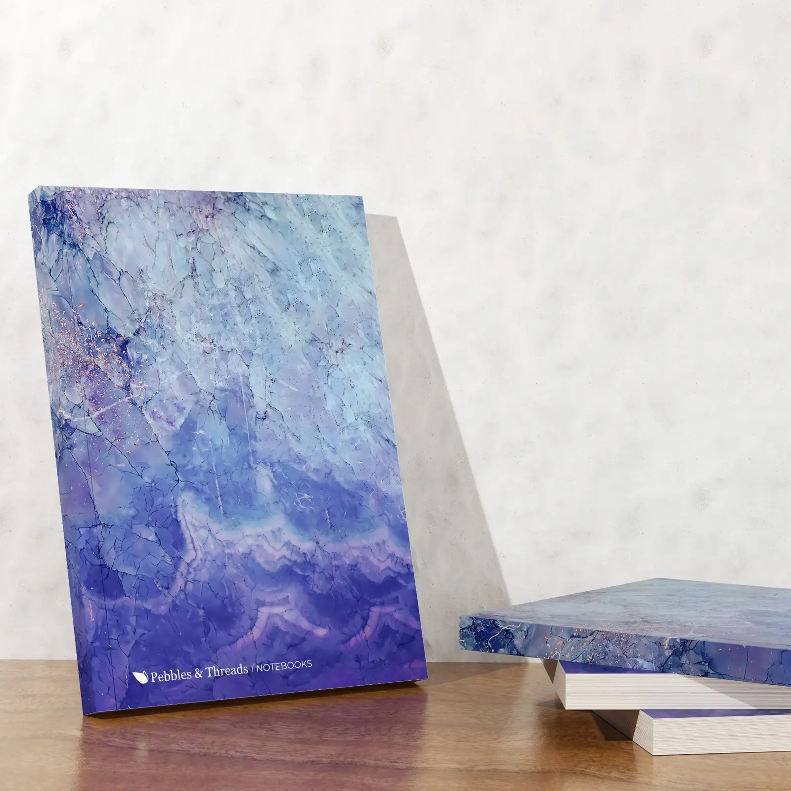Blue Waves notebook with a small stack showing the cover and page edges